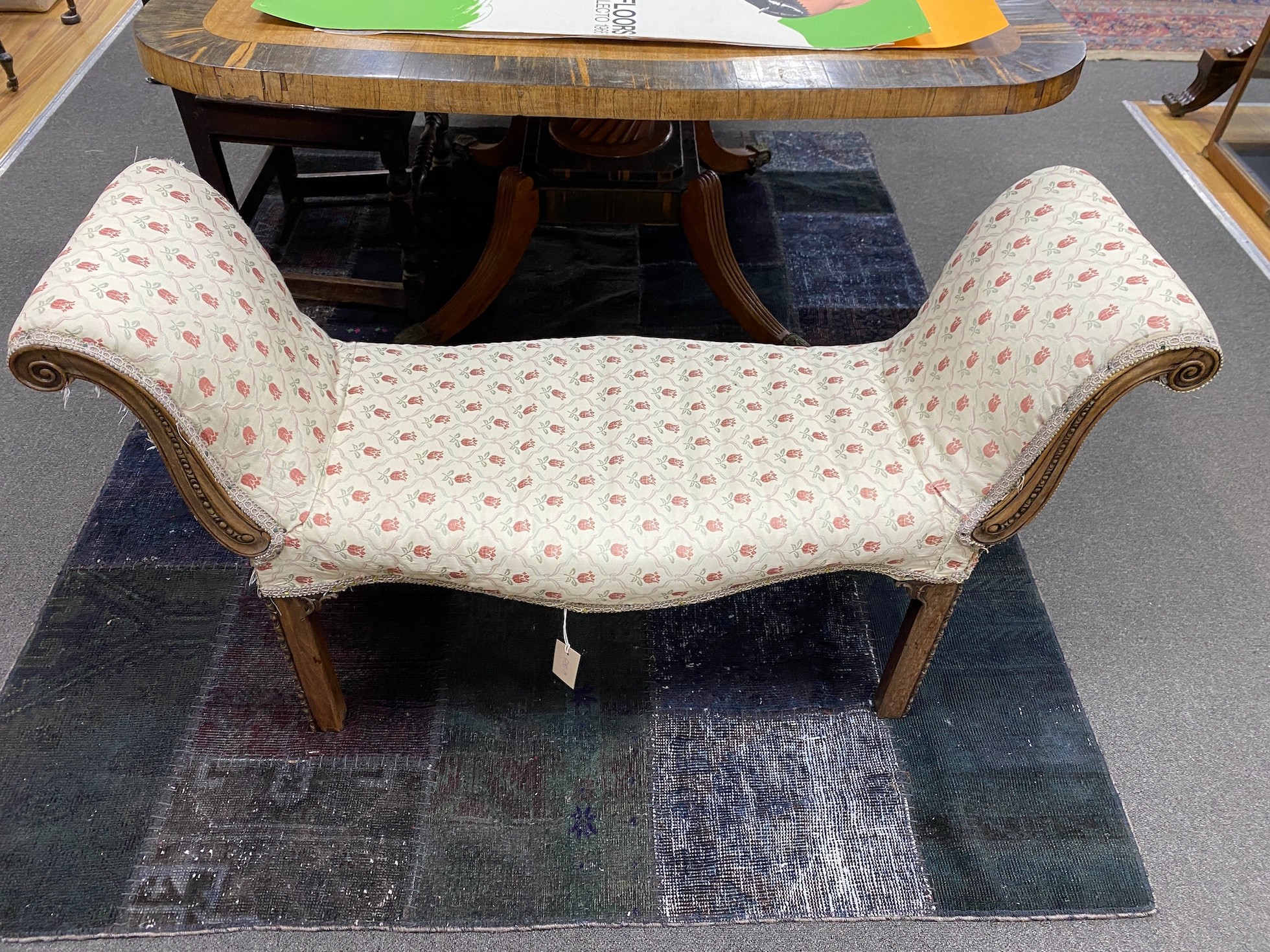 A George III mahogany framed serpentine window seat, c.1780, width 110cm, height 66cm